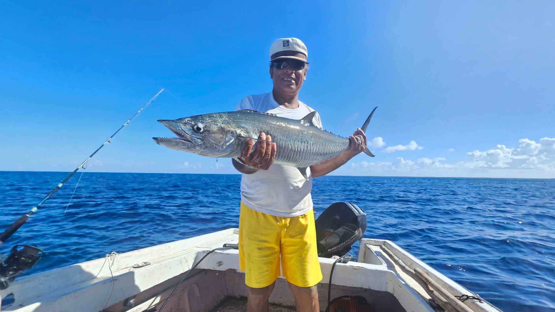 Captain Steeve with a big catch on the turquoise waters of Mauritius